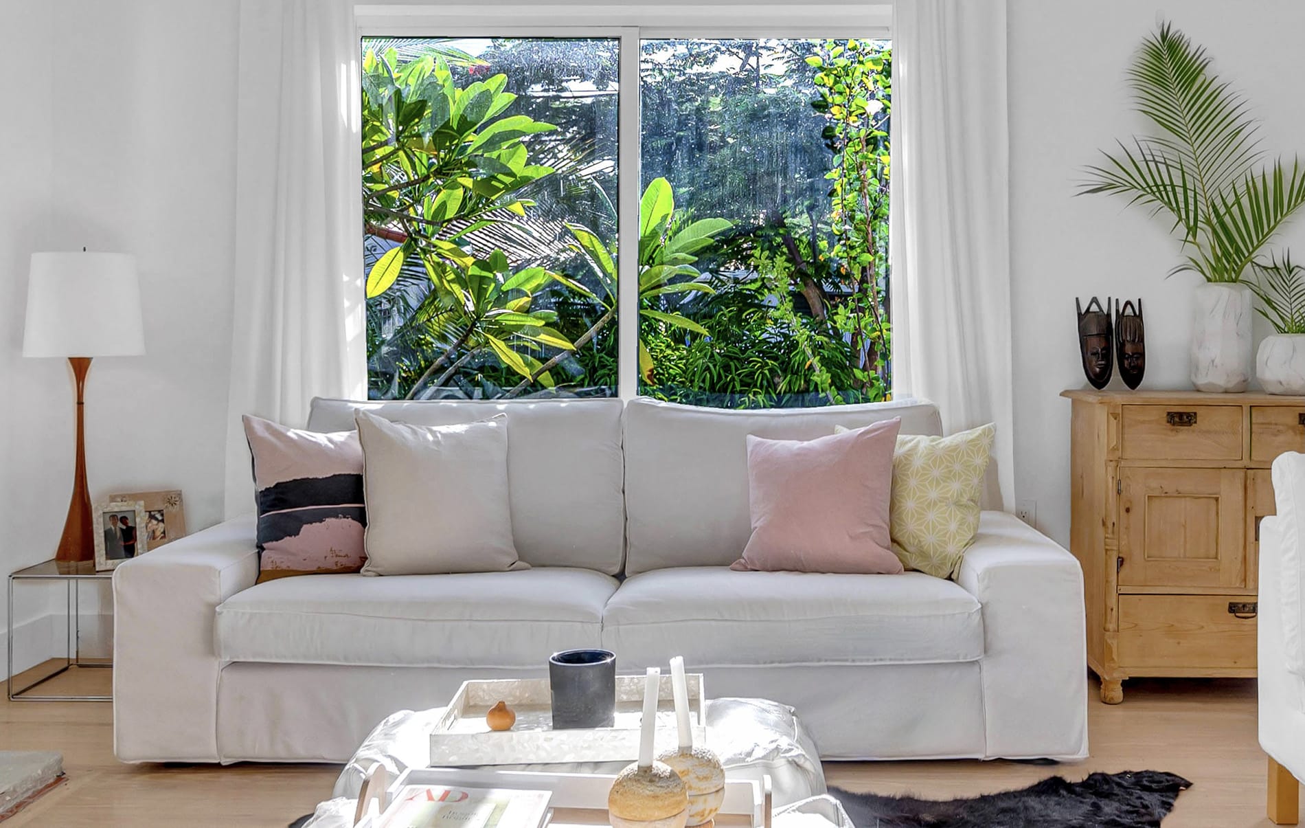 Coconut Grove home renovation - living room couch with a big window behind, designed by Beatrice Leupold Coconut Grove home renovation - living room couch with a big window behind, designed by Beatrice Leupold